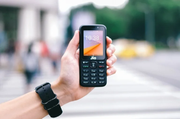 A hand holding a JioPhone