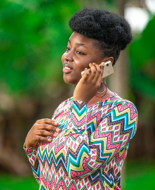A person using a mobile phone outdoors